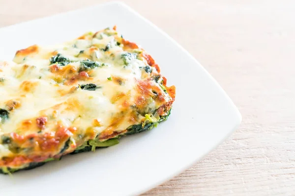 Baked spinach with cheese — Stock Photo, Image