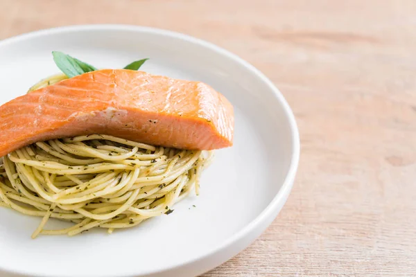 Pasta spaghetti with pesto green and salmon — Stock Photo, Image