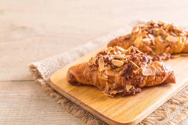 Croissant with almonds — Stock Photo, Image
