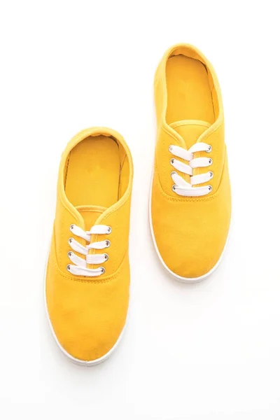 Sneakers gialle su sfondo bianco — Foto Stock