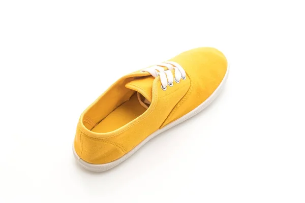 Κίτρινο πάνινα παπούτσια σε άσπρο φόντο — Φωτογραφία Αρχείου