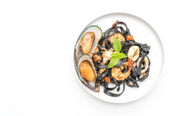 黒のスパゲティや魚介類のパスタ ロイヤリティフリーのストック写真