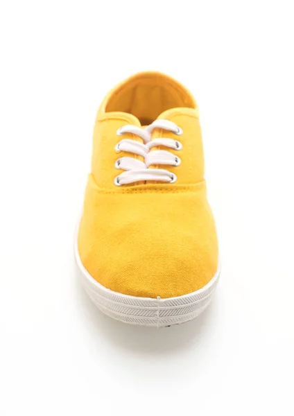 白い背景の上の黄色スニーカー — ストック写真