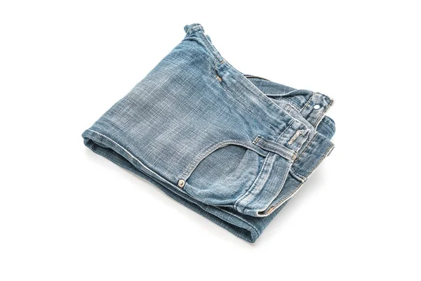 Jeans dobrado sobre fundo branco — Fotografia de Stock