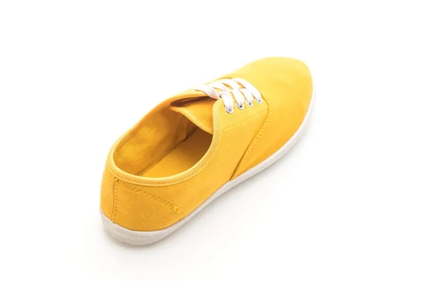 在白色背景上的黄色运动鞋 — 图库照片