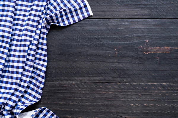 kitchen cloth (napkin) on wood background