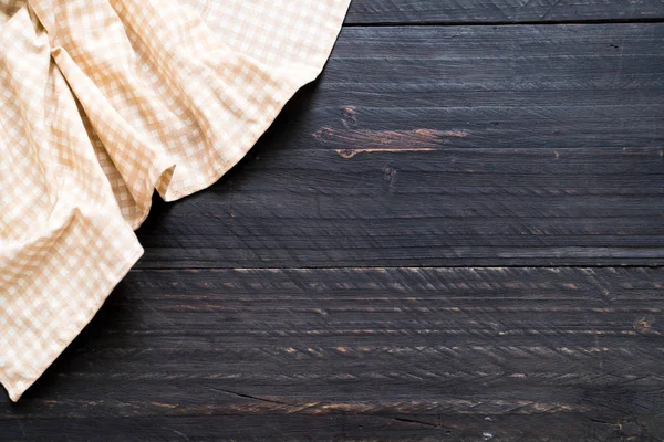 Kitchen cloth (napkin) on wood background — Stock Photo, Image