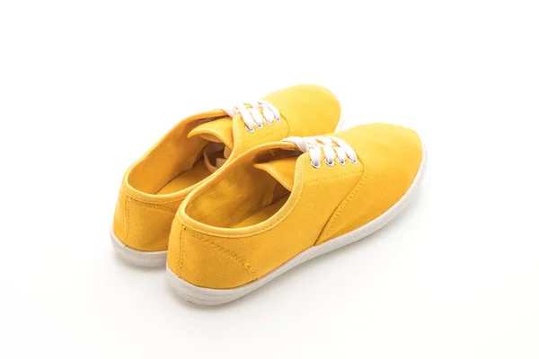 在白色背景上的黄色运动鞋 — 图库照片