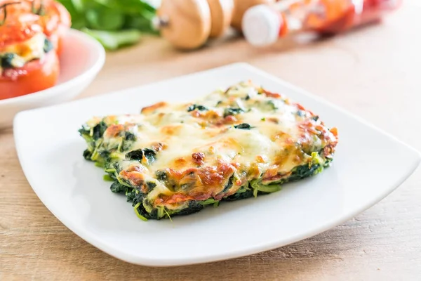 Baked spinach with cheese — Stock Photo, Image