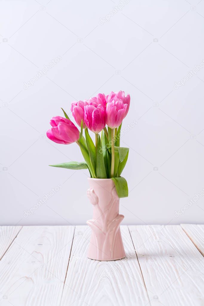 pink tulip flower on wood background