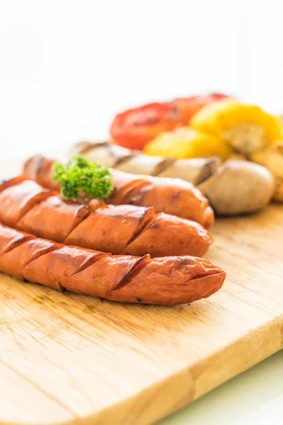 Mix grilled sausage with vegetables and french fries — Stock Photo, Image