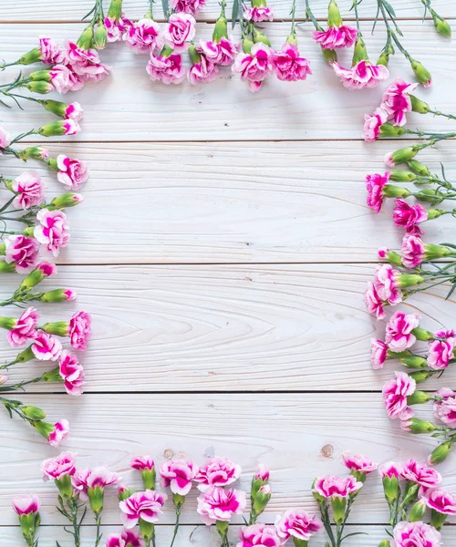 pink spring flower on wooden background