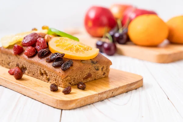 Fruit cake on wood — Stock Photo, Image