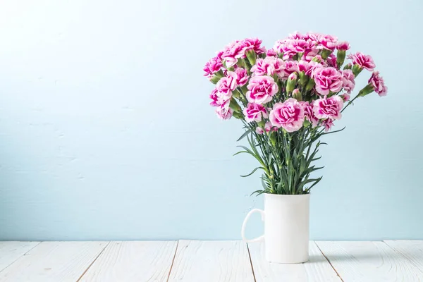 pink spring flower on wooden background