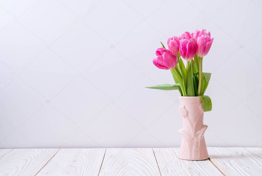 pink tulip flower on wood background