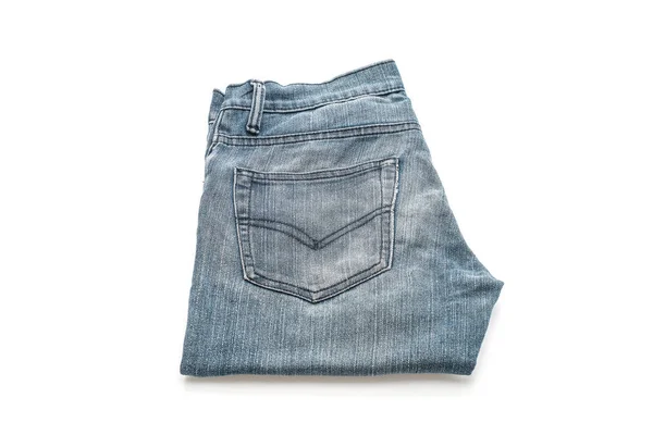 Jeans doblados sobre fondo blanco — Foto de Stock