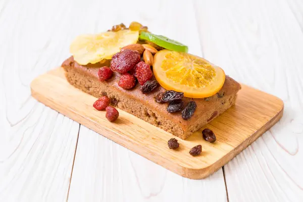 Fruit cake on wood — Stock Photo, Image