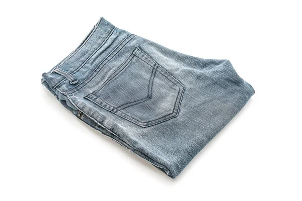 Jeans gefaltet auf weißem Hintergrund — Stockfoto