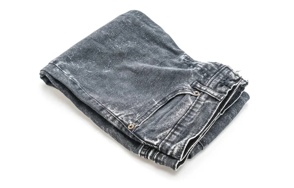 Jeans gefaltet auf weißem Hintergrund — Stockfoto