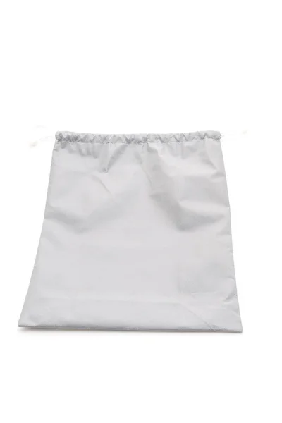 Красивая ткань мешок на белом фоне — стоковое фото