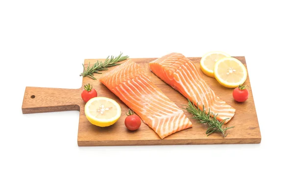 Raw salmon fillet with tomatoes lemon rosemary pepper and salt — Stock Photo, Image
