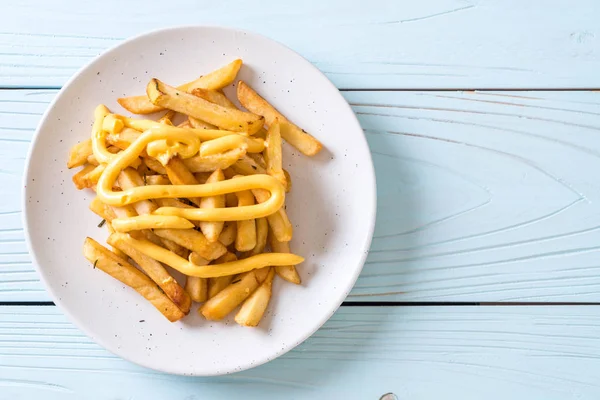 French fries with cheese — Stock Photo, Image