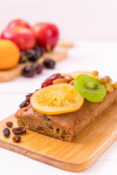 Fruit cake on wood — Stock Photo, Image