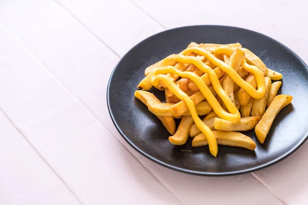 French fries with cheese — Stock Photo, Image