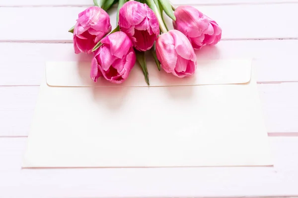 pink tulip flower on wood background