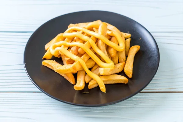 French fries with cheese — Stock Photo, Image