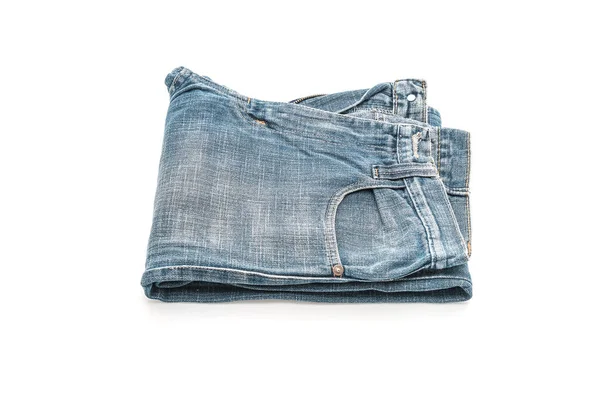 Jeans som viks på vit bakgrund — Stockfoto