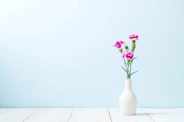 pink spring flower on wood background