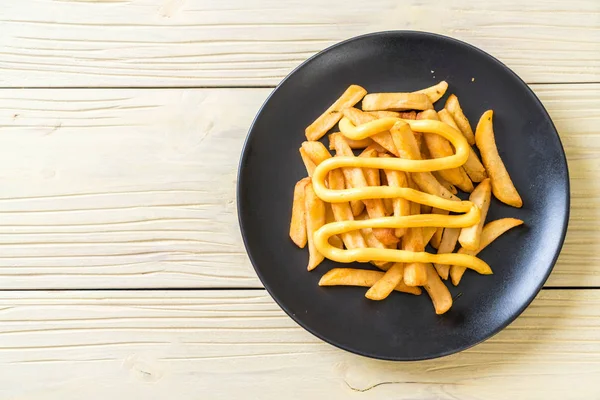 French fries with cheese — Stock Photo, Image