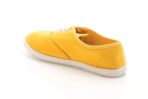 Κίτρινο πάνινα παπούτσια σε άσπρο φόντο — Φωτογραφία Αρχείου