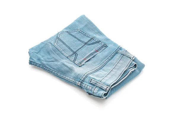 Jeans dobrado sobre fundo branco — Fotografia de Stock