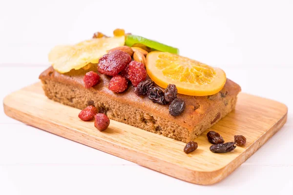 Fruit cake on wood — Stock Photo, Image