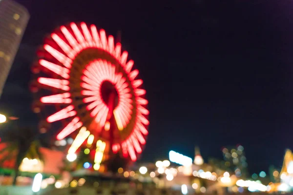 Bokeh rozostřeného noční přístav světla pozadí s ruské kolo — Stock fotografie