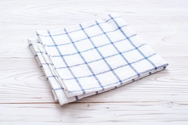 kitchen cloth (napkin) on wood background