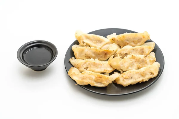 Aperitivo japonés gyoza o dumplings con salsa de soja —  Fotos de Stock