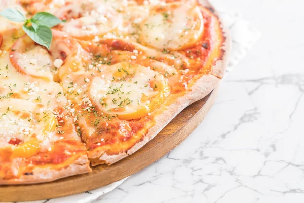 tomatoes pizza on table