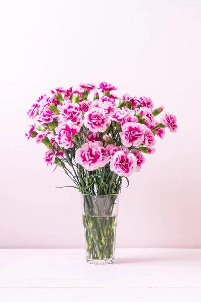 pink spring flower on wood background