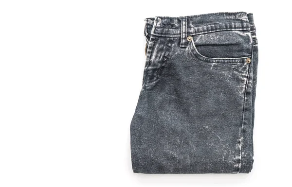 Jeans doblados sobre fondo blanco — Foto de Stock