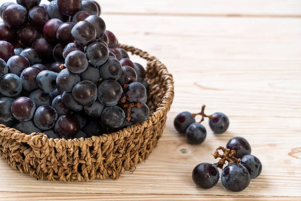 Fresh black grapes on white background — Stock Photo, Image
