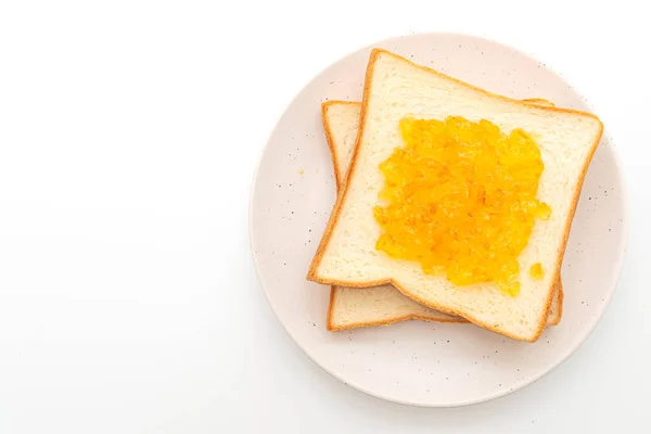 Slices of bread with orange jam — Stock Photo, Image