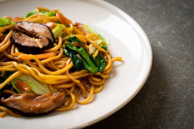 yakisoba noodles stir-fried with vegetable in asian style - vega