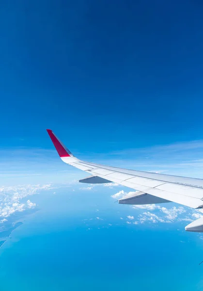 Clouds and sky as seen through window of an aircraft — Stock Photo, Image