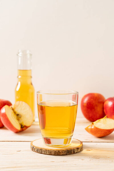 Apple juice with red apples fruits