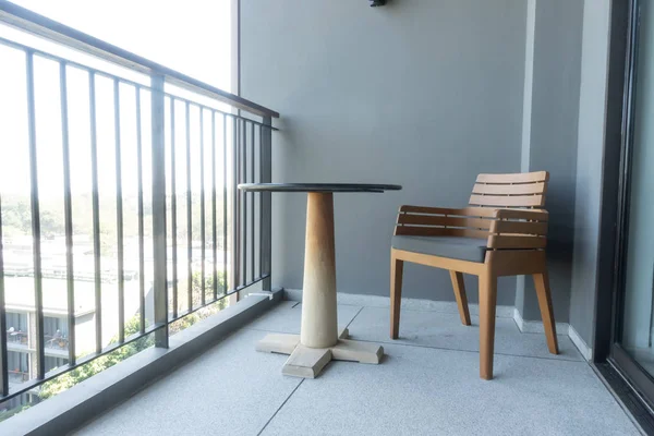 wood chair and table on balcony