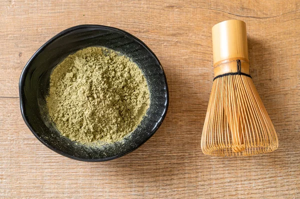 matcha green tea powder with whisk