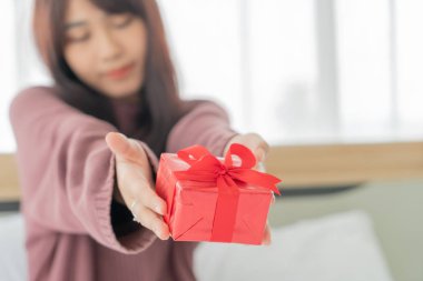 Asian women happy to receive a gift box